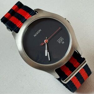 Nixon The Quad Men's Watch Silver Stainless Navy Blue Dial Red Striped Band A348